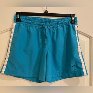 Nike athletic shorts for men. Turquoise with white trim. Size Small.